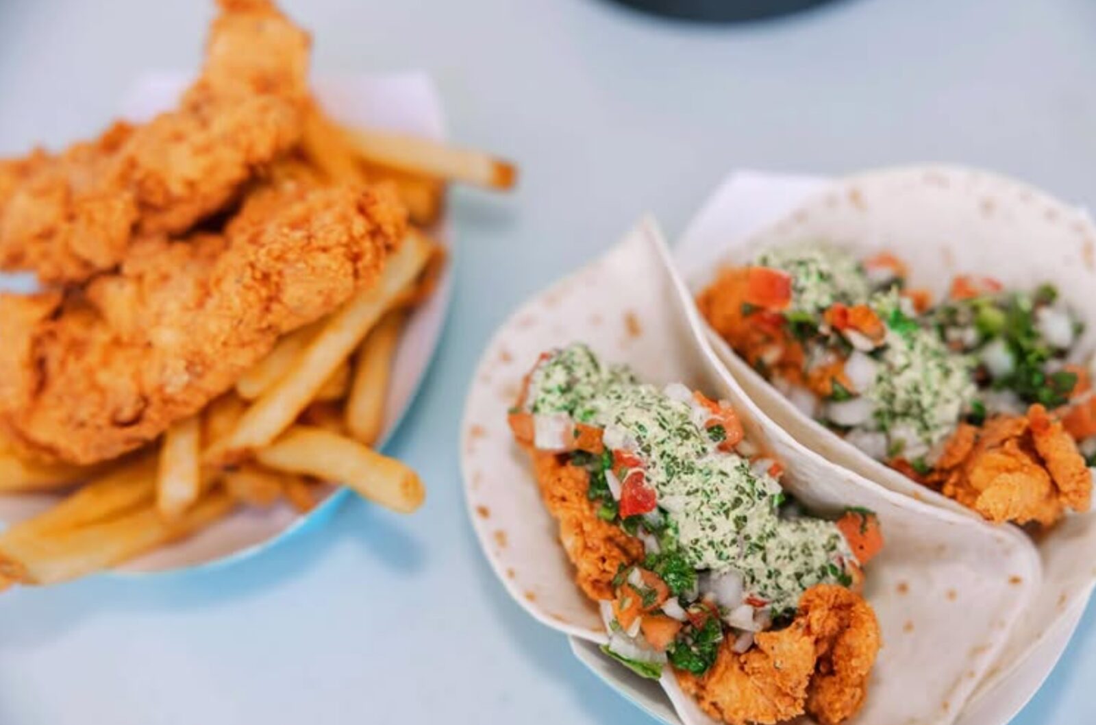 Plated chicken tacos and fries